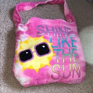 Towel that fold up into a purse